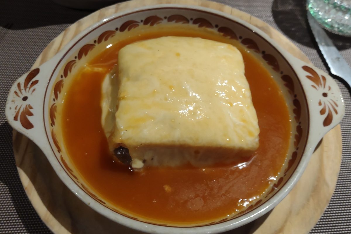 A francesinha, the Porto sandwich covered in melted cheese and sauce